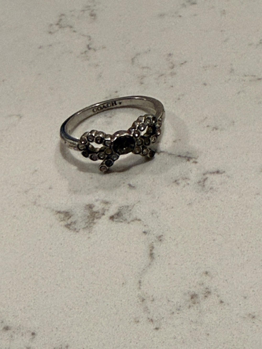 COACH Rhinestone Bow Accent Ring - Silver Tone with Smoky Gem